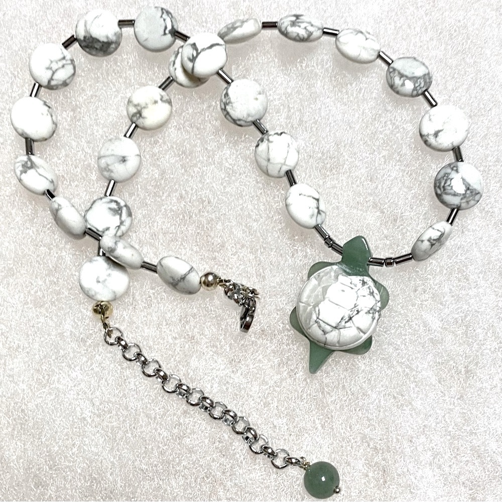 Handmade OOAK one of a kind white howlite and green aventurine turtle necklace.